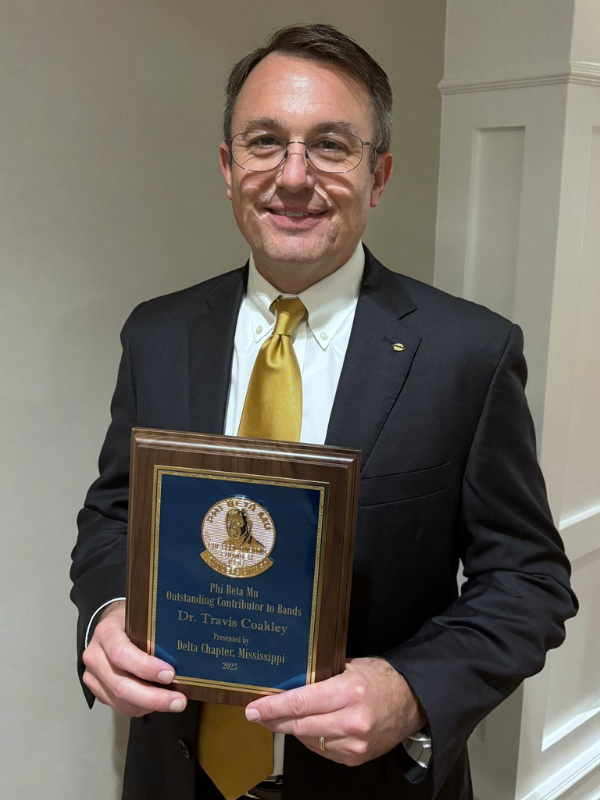 Dr. Coakley with award